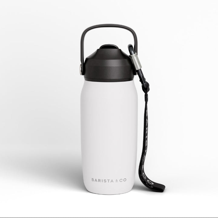 A matte white insulated water bottle with a carrying loop and wrist strap, featuring the BARISTA & CO logo near the base, set against a clean white background.