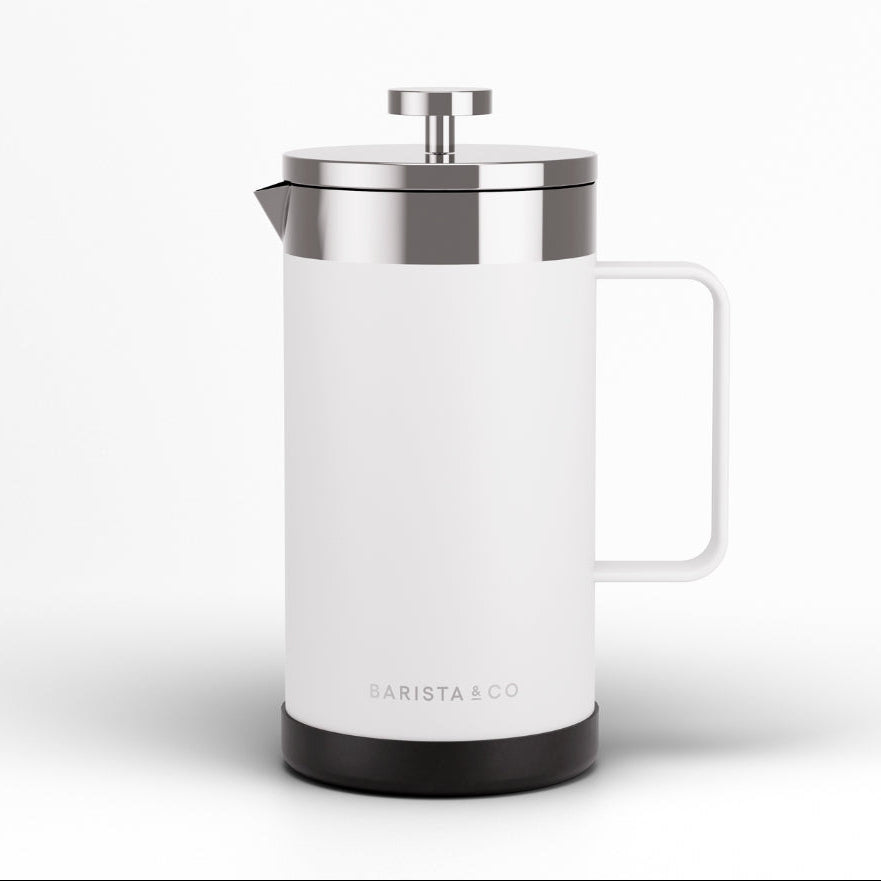 A white French press coffee maker with a brushed silver metal lid and plunger, featuring a white handle and a black base, shown on a clean white background. The brand name 'BARISTA & CO' is printed near the bottom.