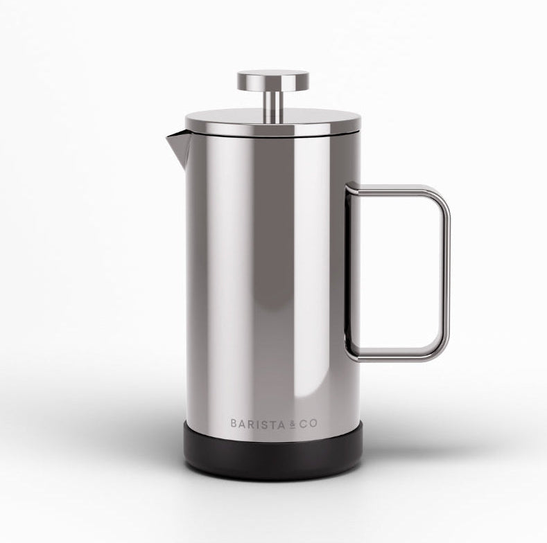 A stainless steel French press coffee maker with a black base and a metal handle, shown on a clean white background. The brand name 'BARISTA CO' is printed near the bottom.