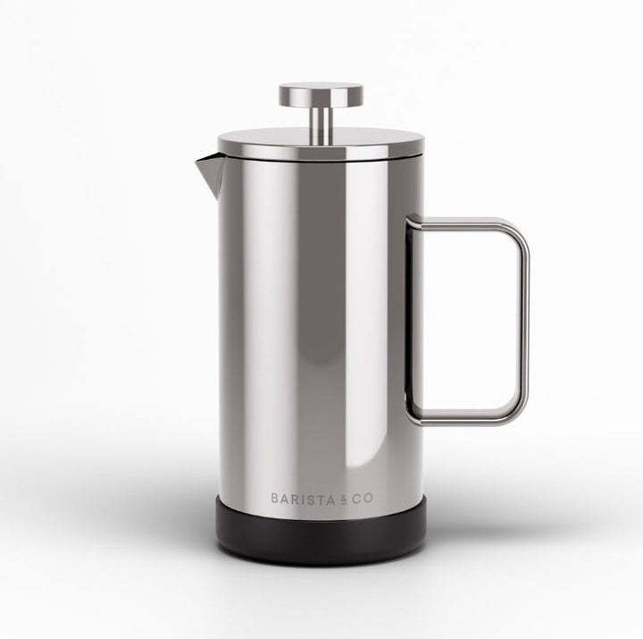 A stainless steel French press coffee maker with a black base and a metal handle, shown on a clean white background. The brand name 'BARISTA CO' is printed near the bottom.