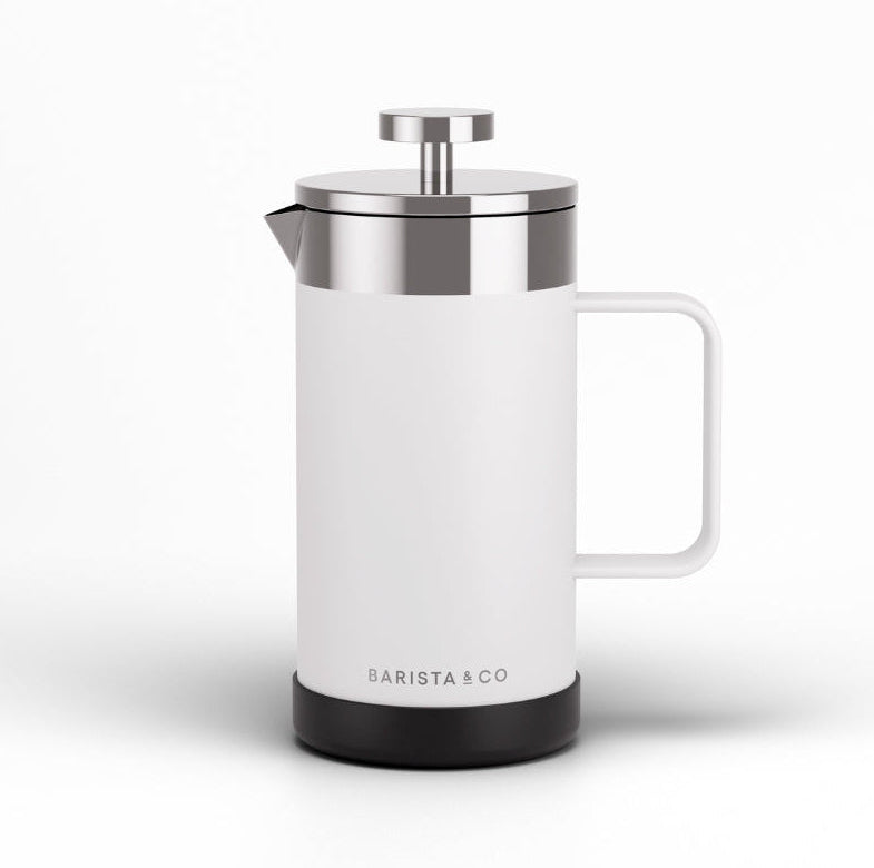 A modern white French press coffee maker with a stainless steel lid and plunger, featuring a black base and the BARISTA & CO logo, set against a clean white background.
