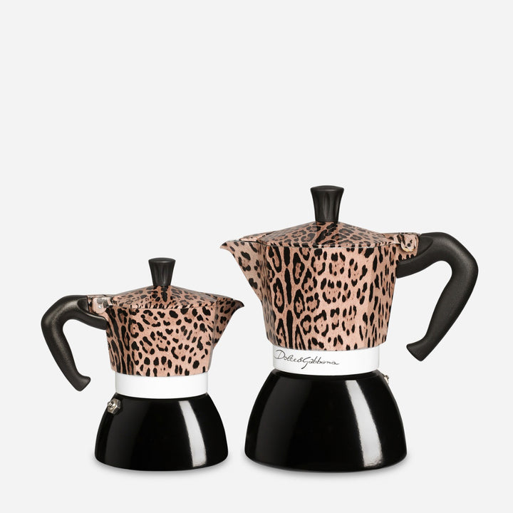 Two moka pots with a leopard print pattern on the upper half and glossy black lower halves, shown on a light gray background.