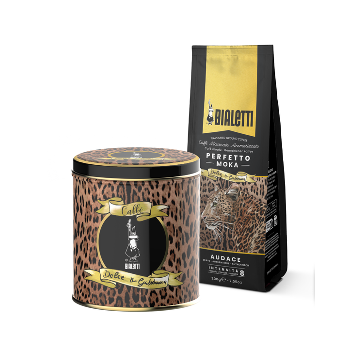 Bialetti coffee gift set featuring a leopard-print tin candle and a matching black and gold bag of Perfetto Moka Arabica coffee on a white background.