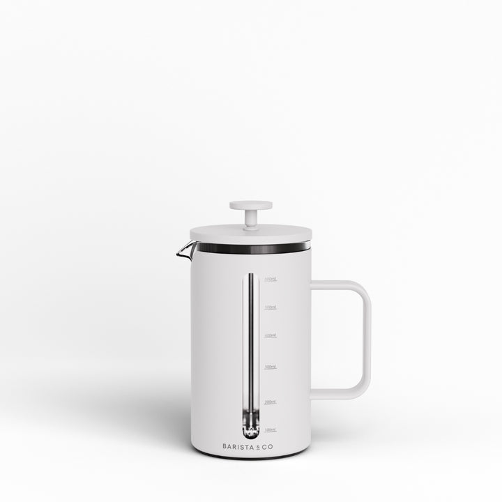 A white French press coffee maker with a handle, featuring a transparent glass plunger, measurement markings, and the BARISTA & CO logo at the bottom, set against a clean white background.