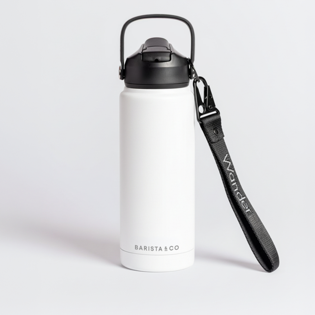 White insulated coffee cup with black handle and strap on a light gray background